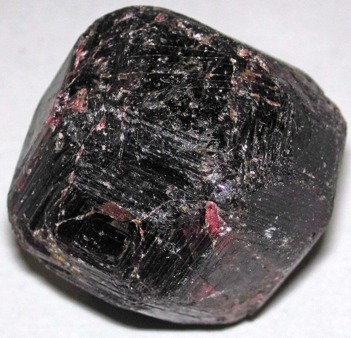 Photograph of Almandine Garnet (Fe₃Al₂(SiO₄)₃ • Isometric Nesosilicate)